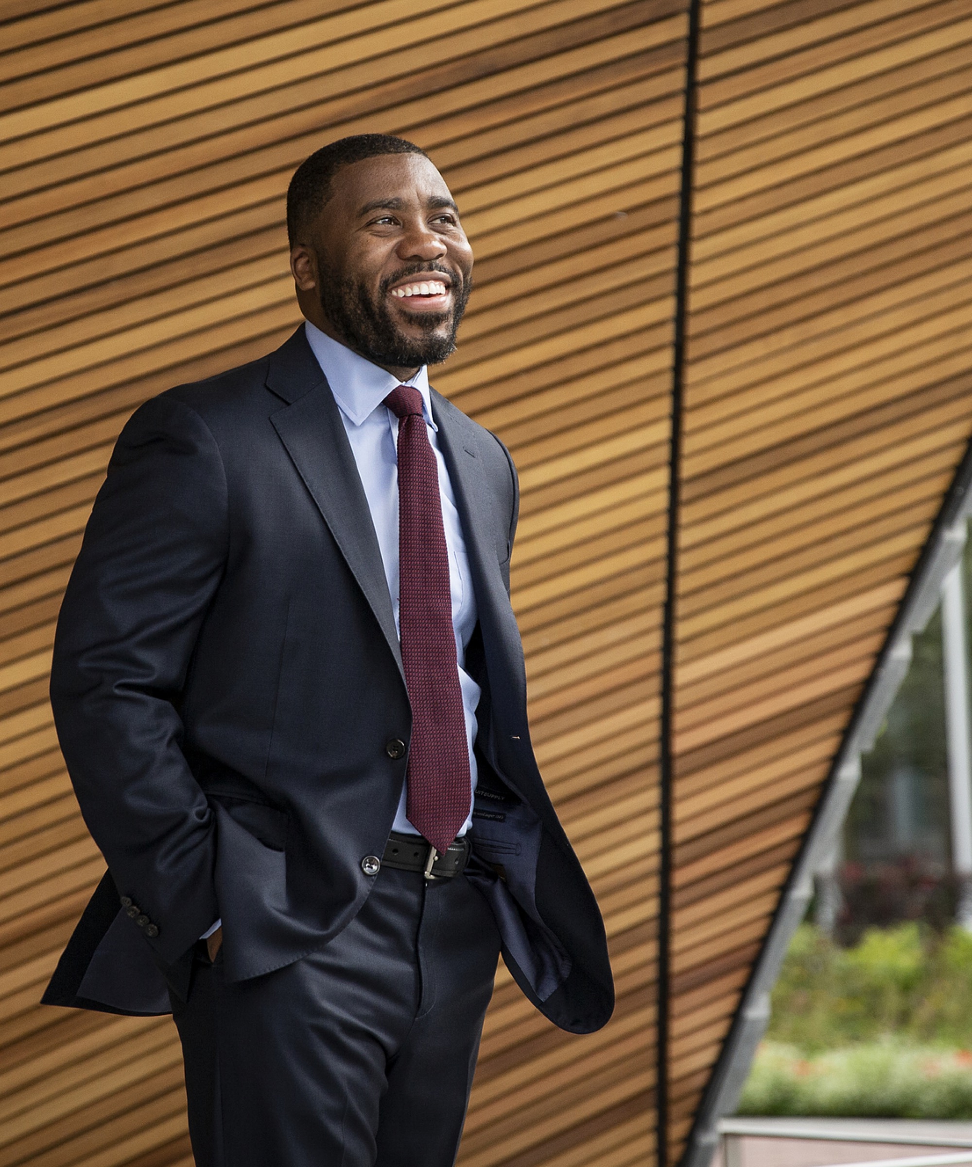 Man smiling in formal attire