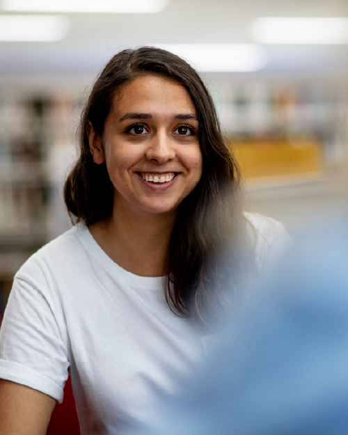 a student smiling in an english class