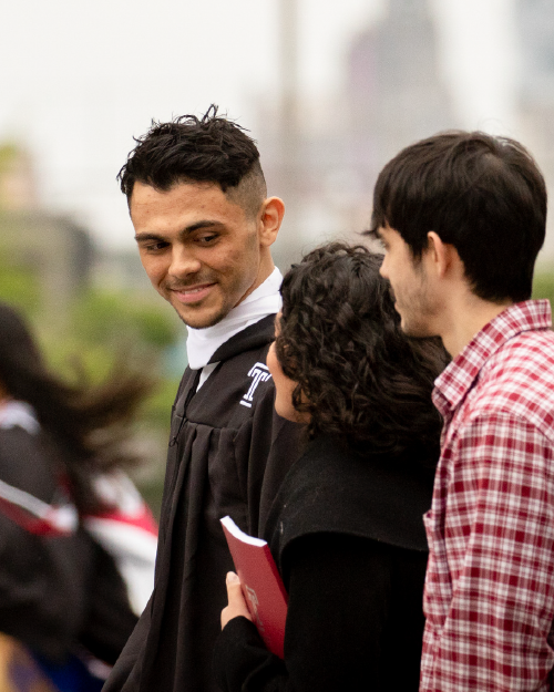 a graduating student with two other friends