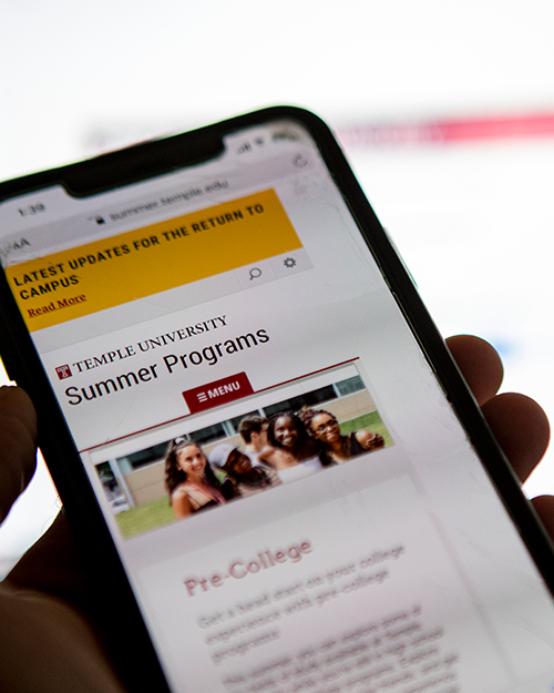 Temple pre-colelge website being shown on a mobile phone