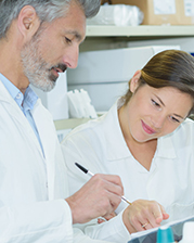 a healthcare worker teaching a trainee